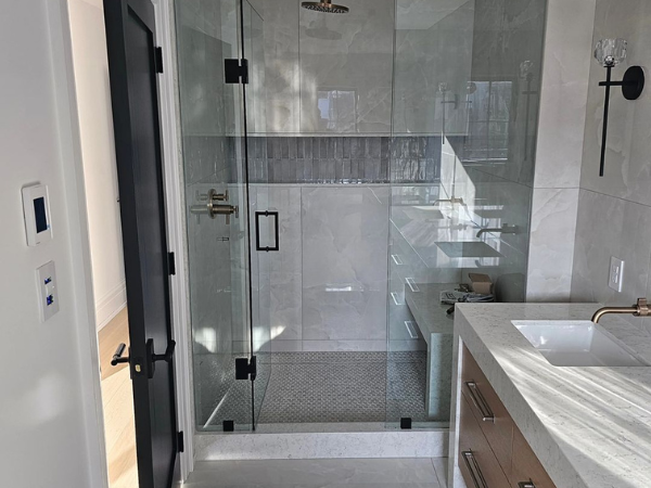 Bathroom renovation project by Chris Tile showing tile floor and modern fixtures, Toronto
