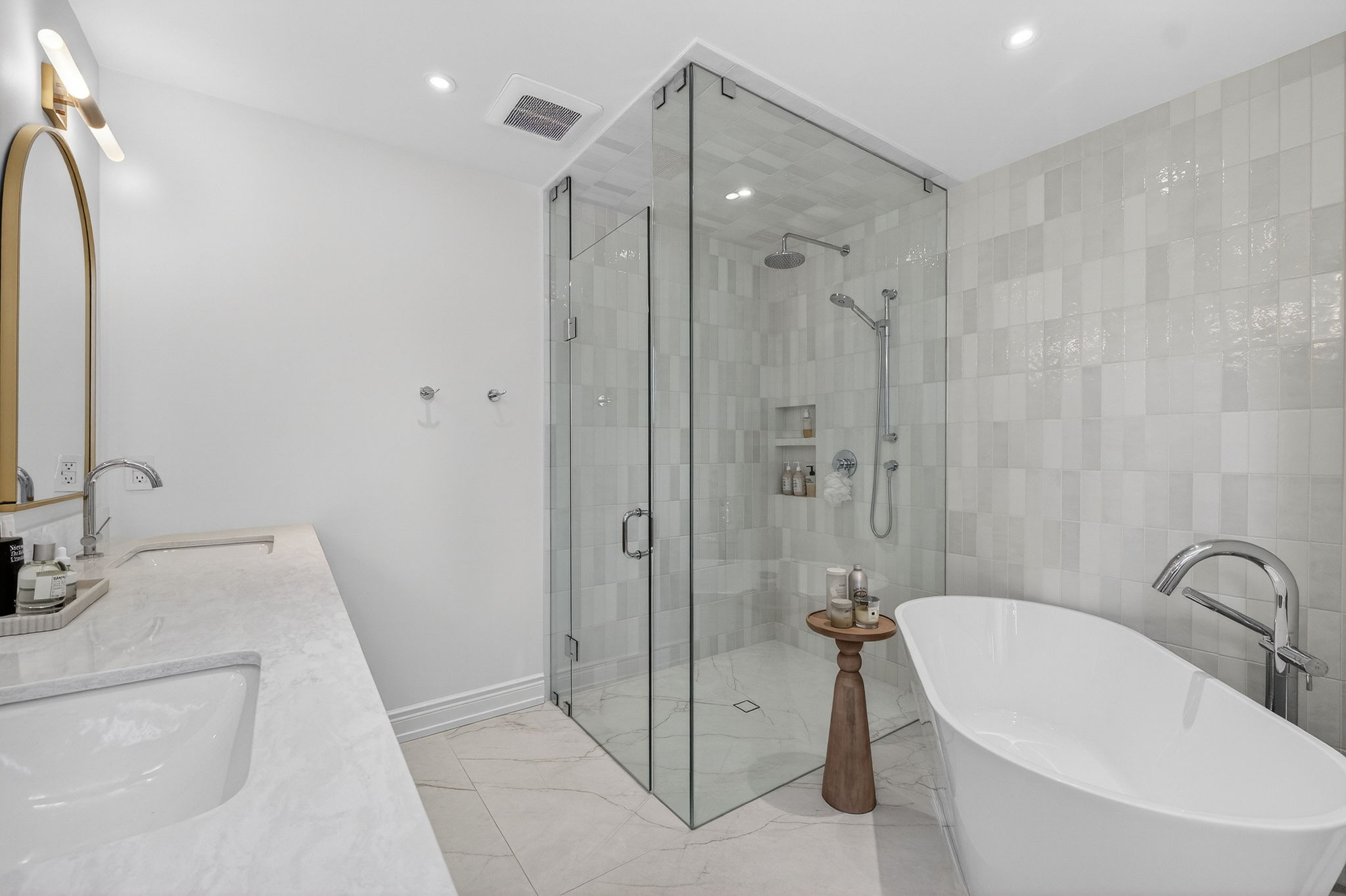 Frameless glass shower with handmade ceramic tile and freestanding tub Mississauga
