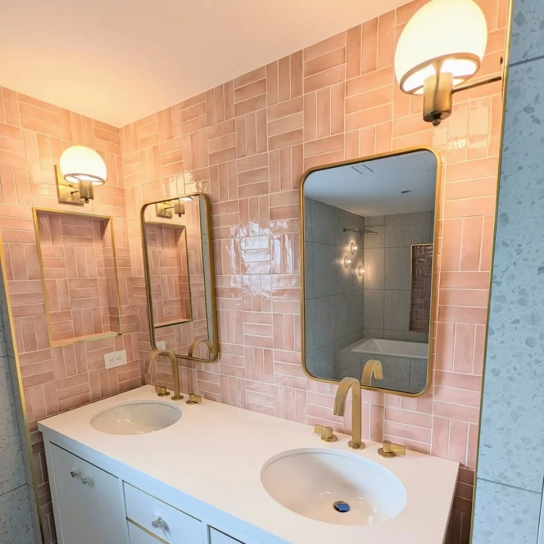 Blush pink zellige tile vanity wall with brass mirrors and sconces Toronto bathroom renovation