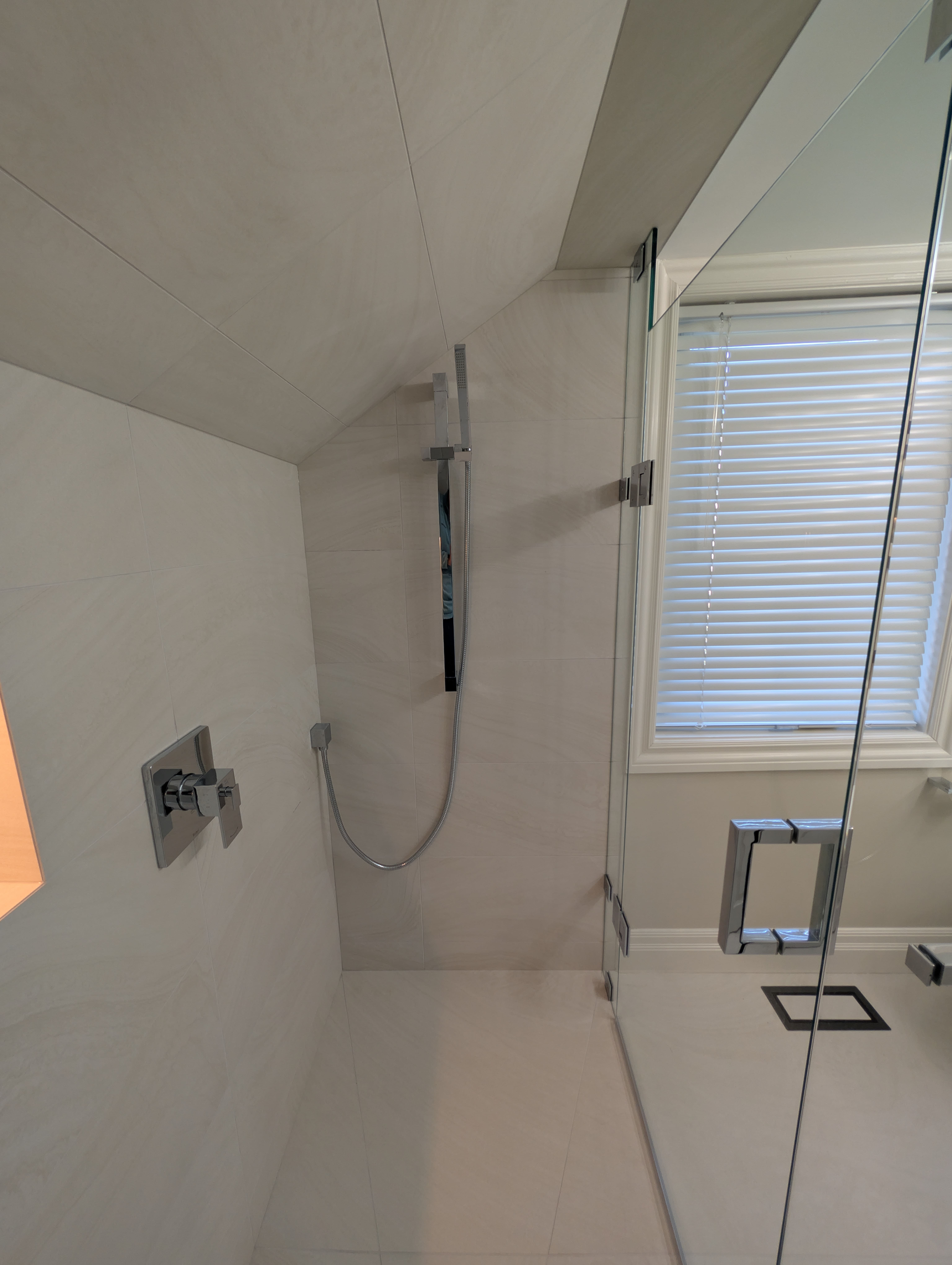 Full bathroom renovation with floating vanity and large format tile Mississauga